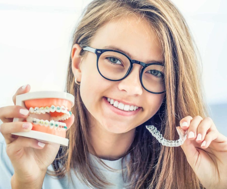 Dental,Invisible,Braces,Or,Silicone,Trainer,In,The,Hands,Of