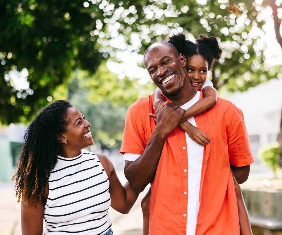A,Joyful,Black,Family,With,A,Child,Laughing,And,Having