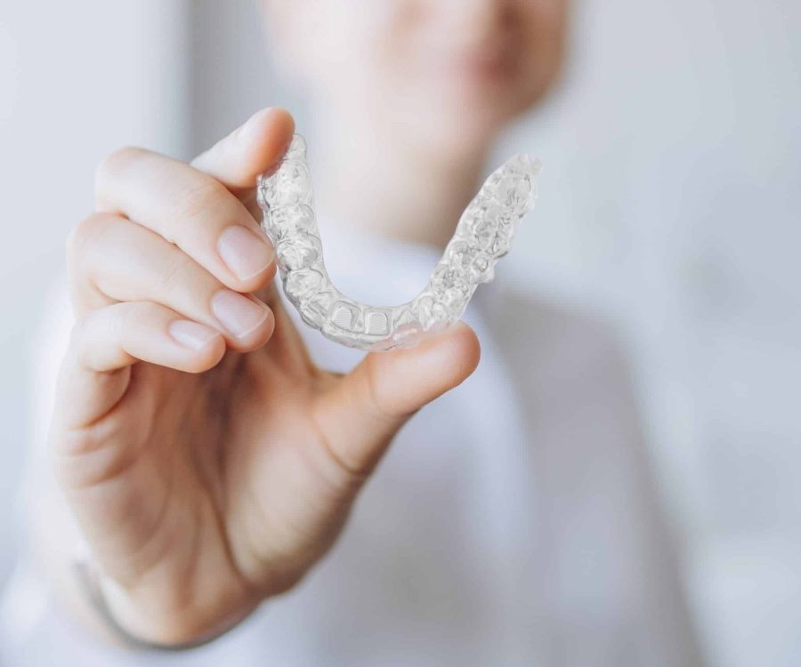 Doctor,Showing,A,Transparent,Aligner,Tray,,Holding,Invisalign-like,For,Orthodontic Doctor,Showing,A,Transparent,Aligner,Tray,,Holding,Invisalign-like,For,Orthodontic